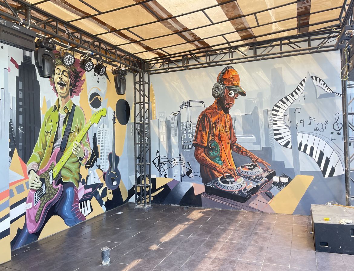 Music-Themed Mural of Guitarist and DJ by Cedar Creative Art